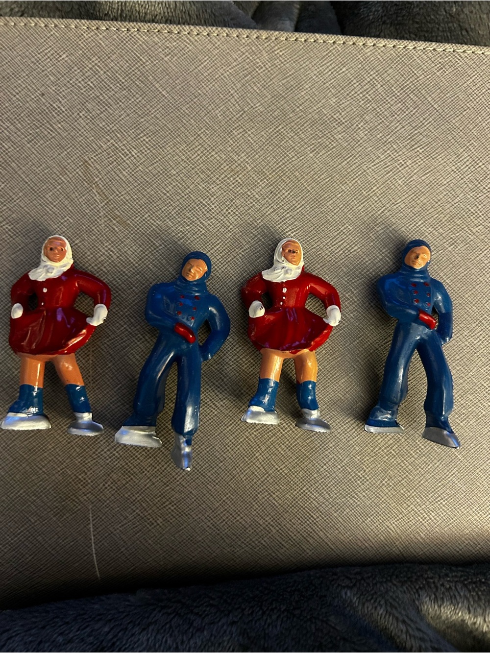 These are vintage 1930s-1950s cast lead ice skater figurines